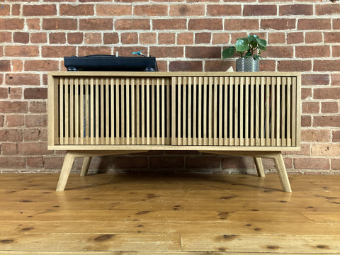 'Ceian' solid oak media unit with sliding doors and rounded oak legs